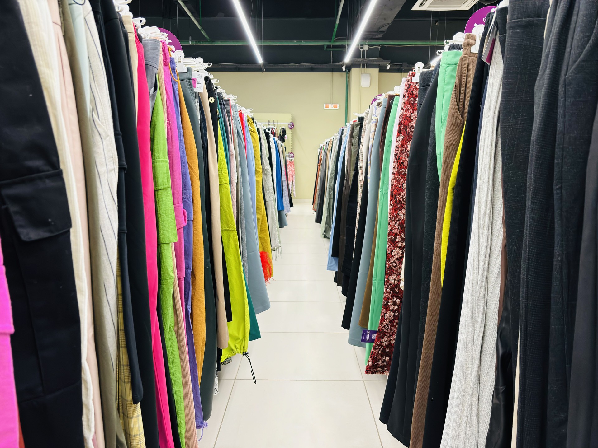 Clothing on hangers, on rails in a second-hand store 2